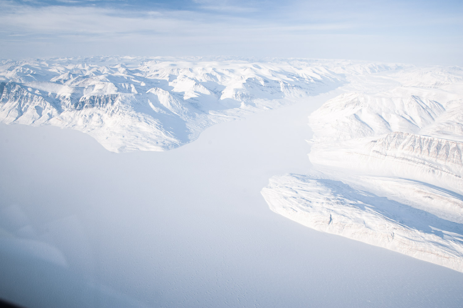 Aerial photo of mountains and frozen sea ice on Ellesmere Island, High Arctic, Canada, Op NUNALIVUT 2008.