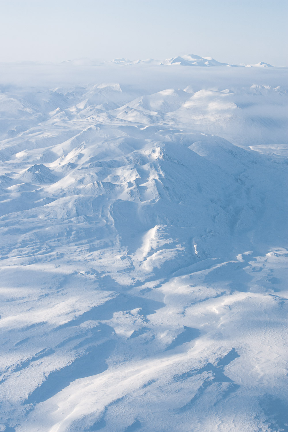 Aerial photo of snow-covered mountains on Ellesmere Island, High Arctic, Canada, Op NUNALIVUT 2008.