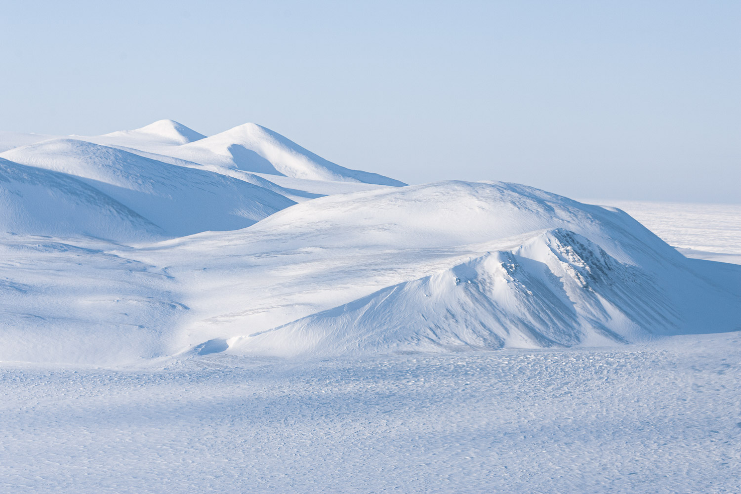 Aerial photo of snow-covered mountains on Ellesmere Island, High Arctic, Canada, Op NUNALIVUT 2008.