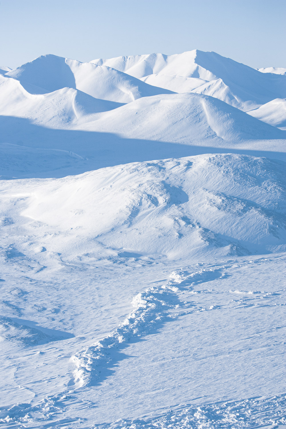 Aerial photo of mountains and frozen sea ice on Ellesmere Island, High Arctic, Canada, Op NUNALIVUT 2008.