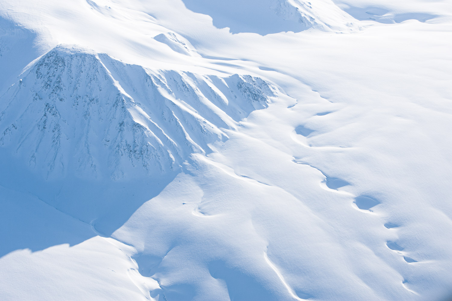 Aerial photo of snow-covered mountain on Ellesmere Island, High Arctic, Canada, Op NUNALIVUT 2008.