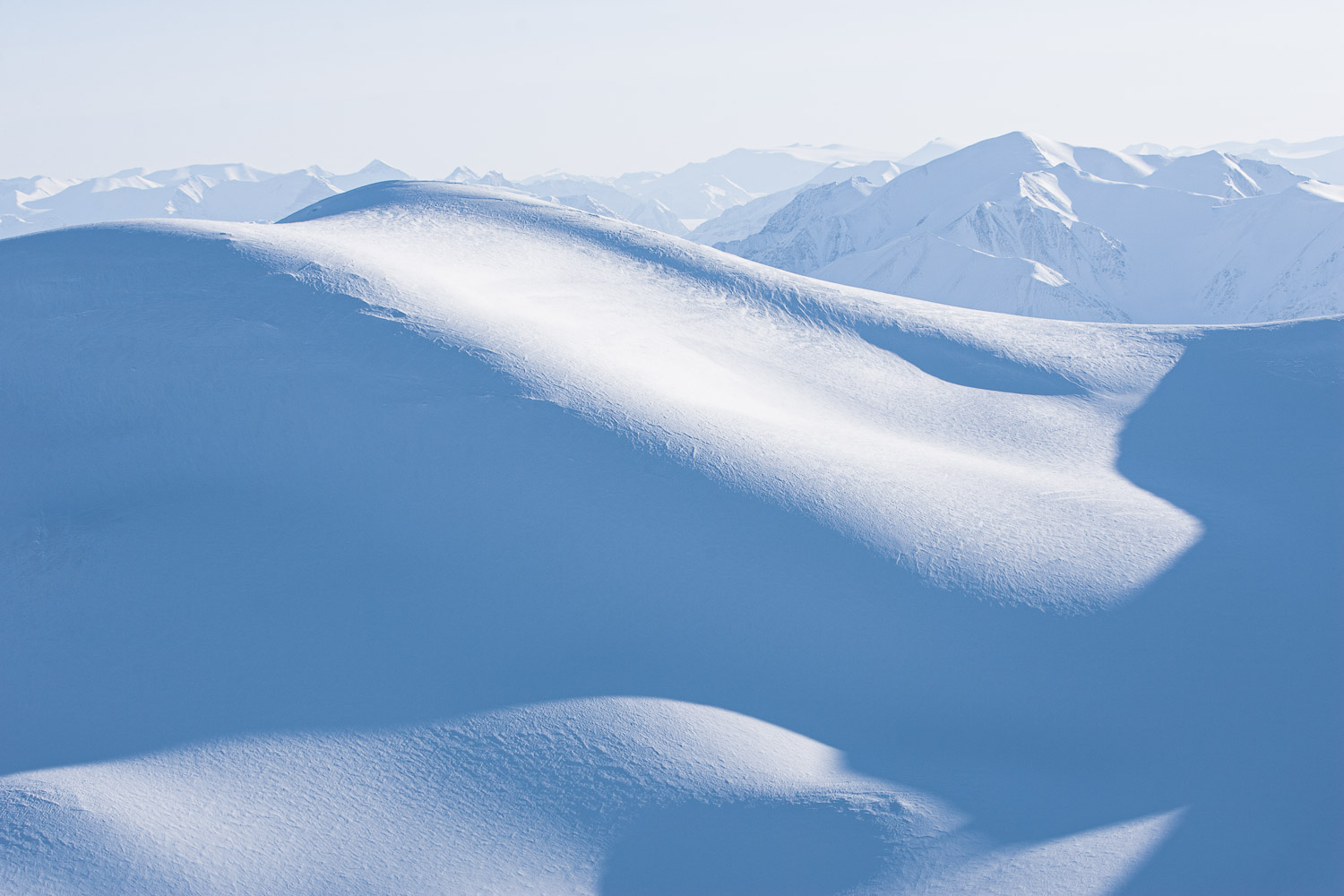 Aerial photo of snow-covered mountains on Ellesmere Island, High Arctic, Canada, Op NUNALIVUT 2008.