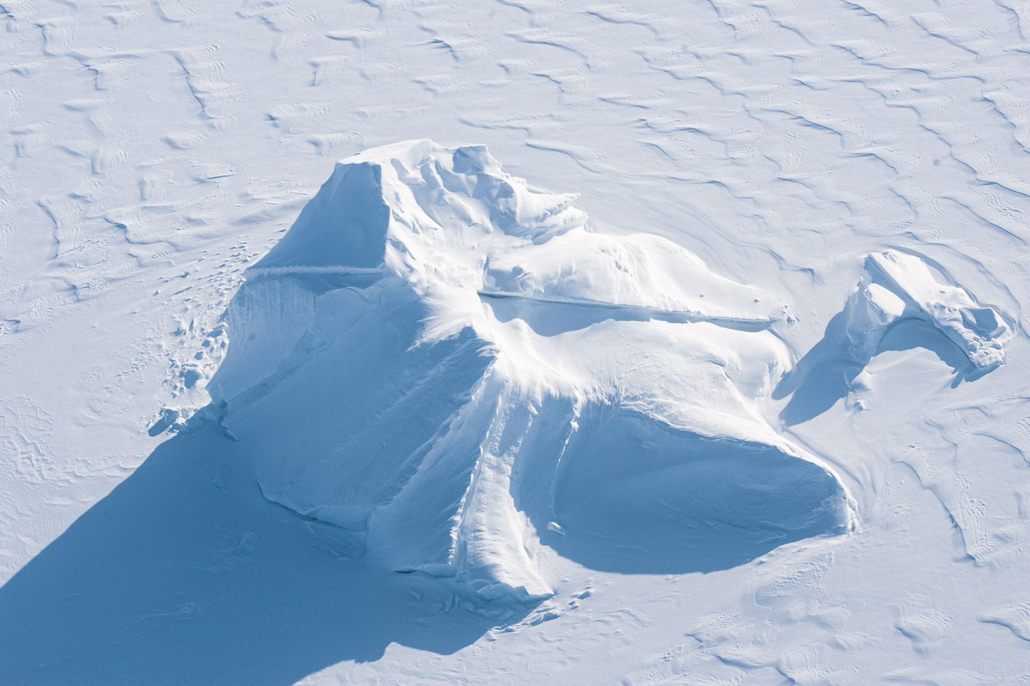 Aerial photo of iceberg and frozen sea ice Ellesmere Island, High Arctic, Canada, Op NUNALIVUT 2008.