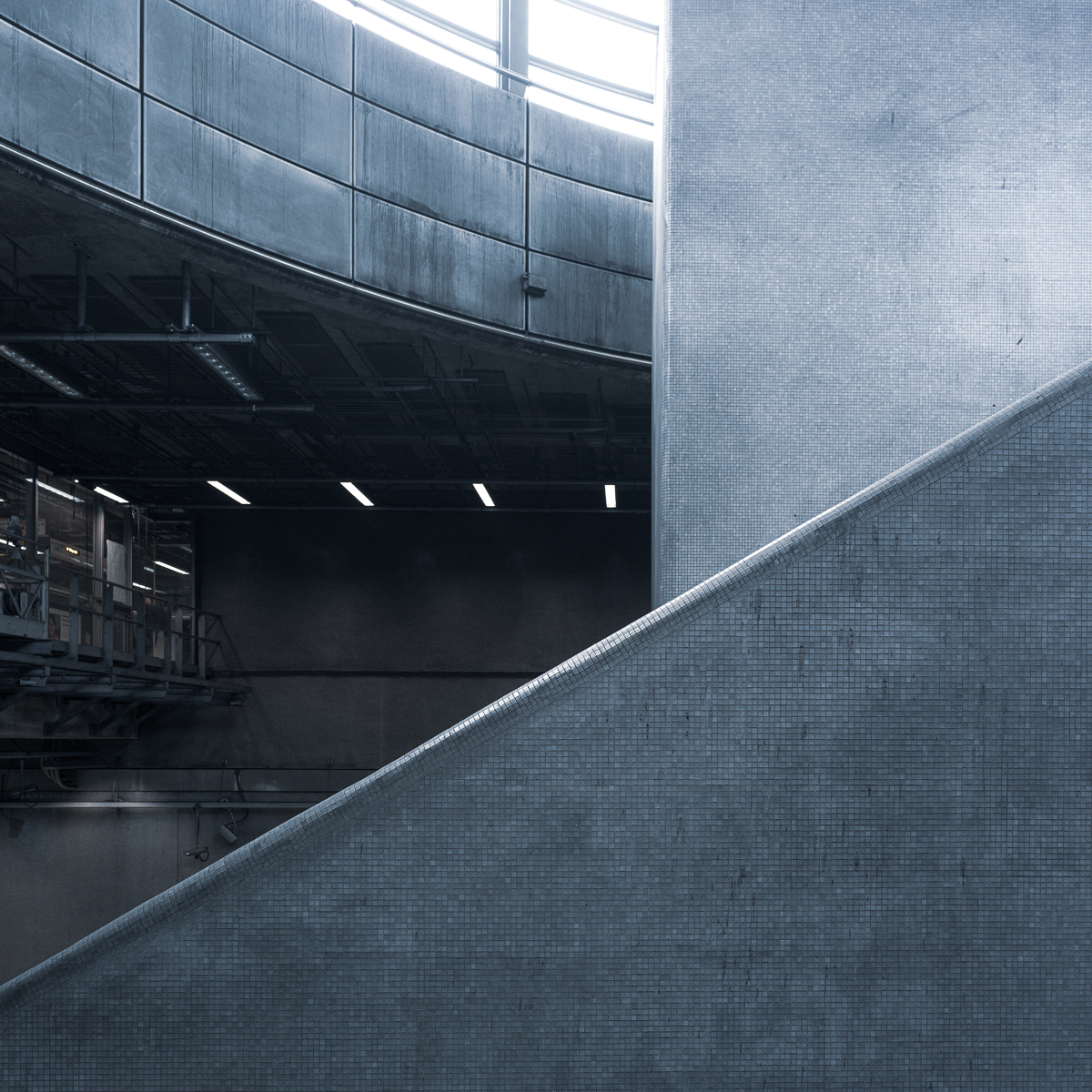 Multi-layered architectural study of Canada Water station, with diagonal wall in foreground, vertical column midground, and curve wall and glass drum in background.