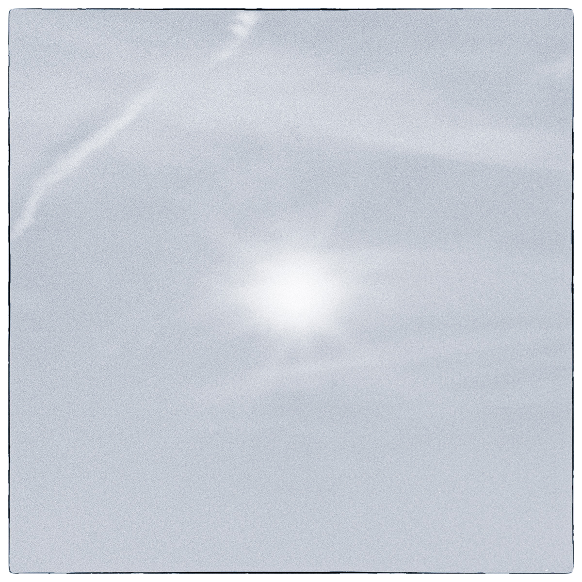 Minimal long-exposure black and white photograph of light and cloud over Lake Ontario in Kingston, with most visual detail dissolved into soft tonal fields.