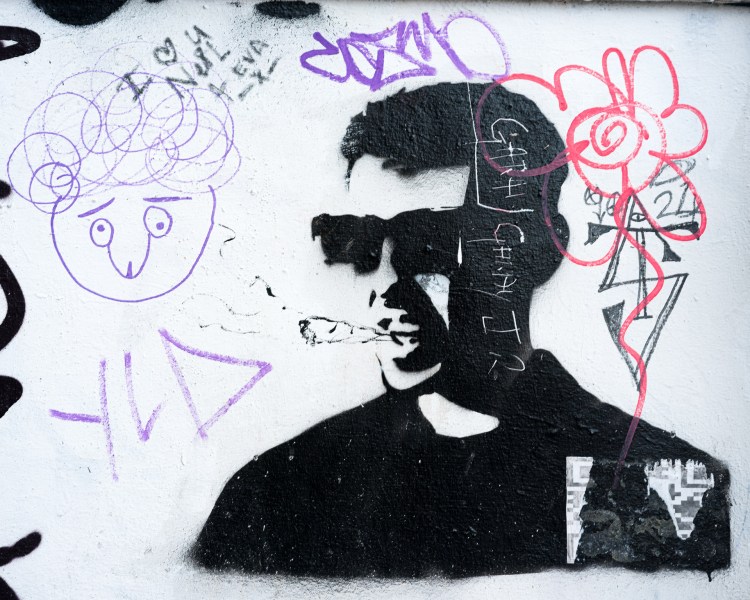 Altered stencil depicting Rick Astley on a wall in Bristol.