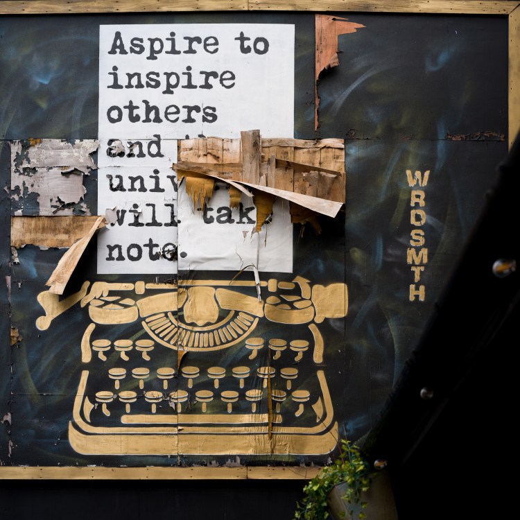 WRDSMTH street artwork featuring a typewriter and typed text on a wall in Bristol.